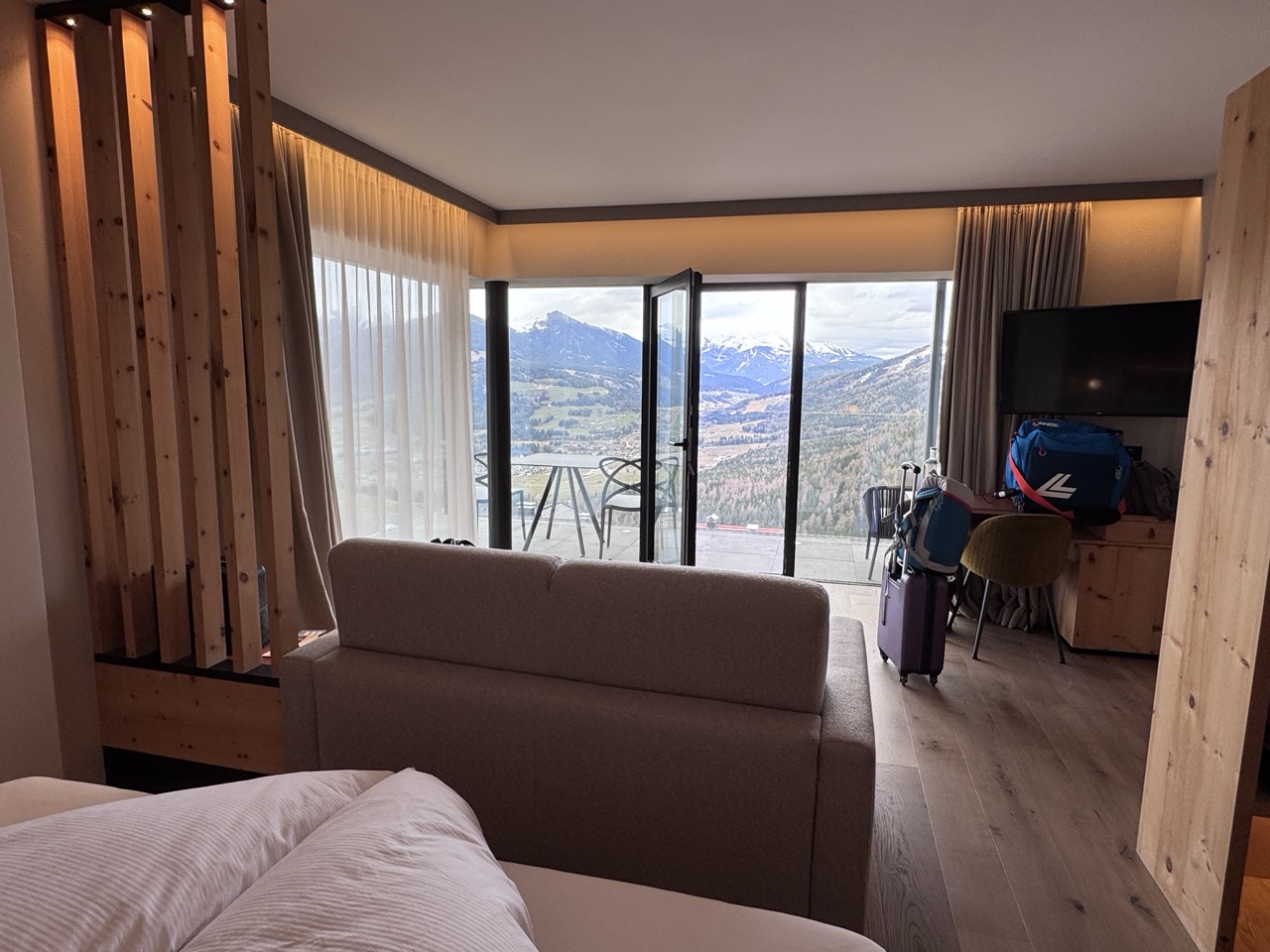 Swiss stone pine hotel room with terrace and mountain view