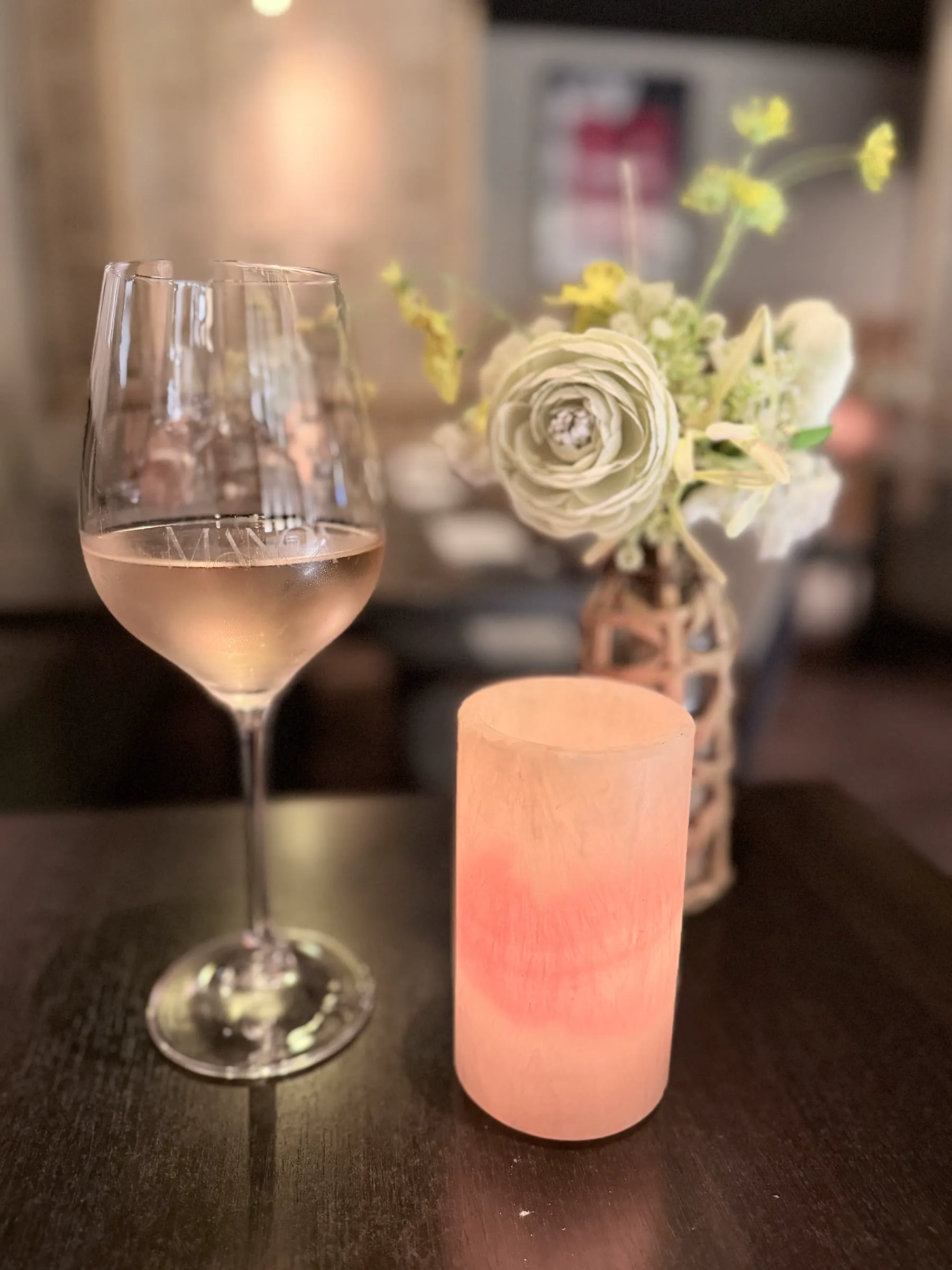 House rosé blush, candle, and flowers at Manca Veldhoven